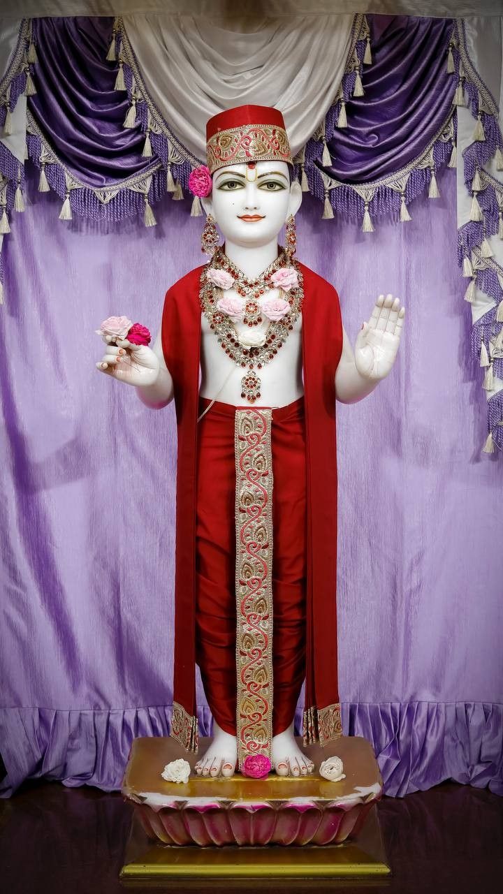 Swaminarayan deity in ornate temple setting