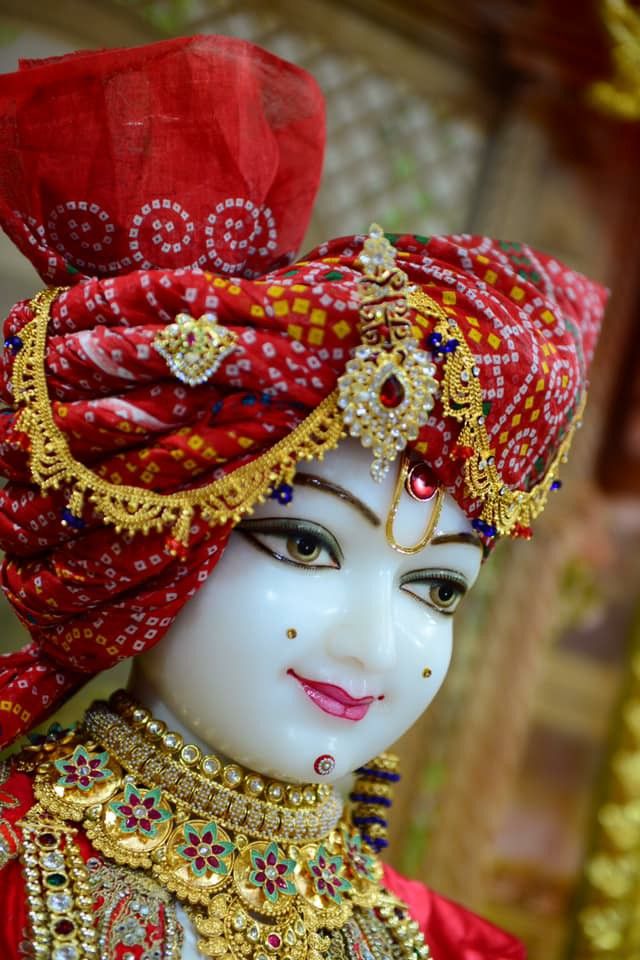 Swaminarayan with ornate golden headgear