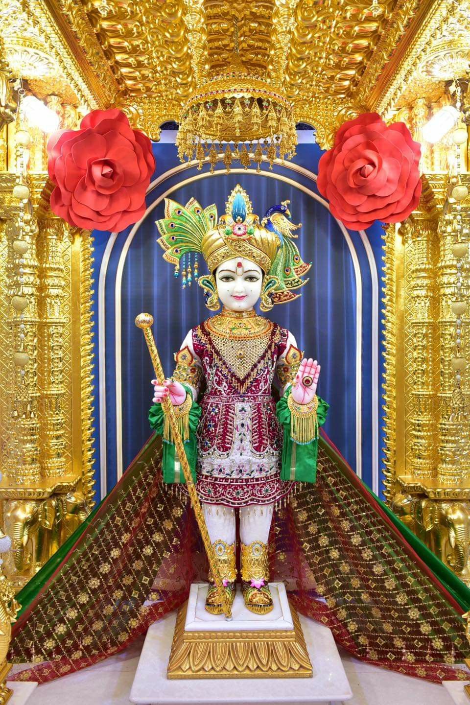 Swaminarayan murti in ornate temple setting