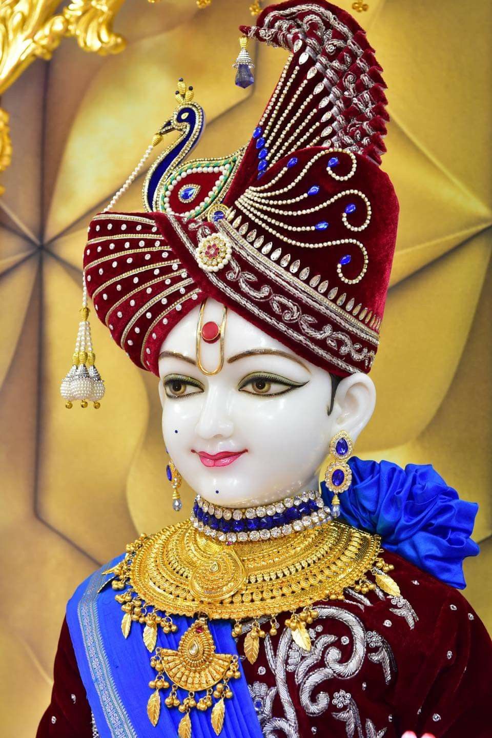 Swaminarayan with ornate crown and jewelry
