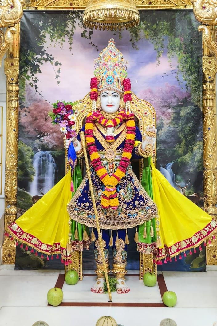 Swaminarayan statue in ornate temple setting
