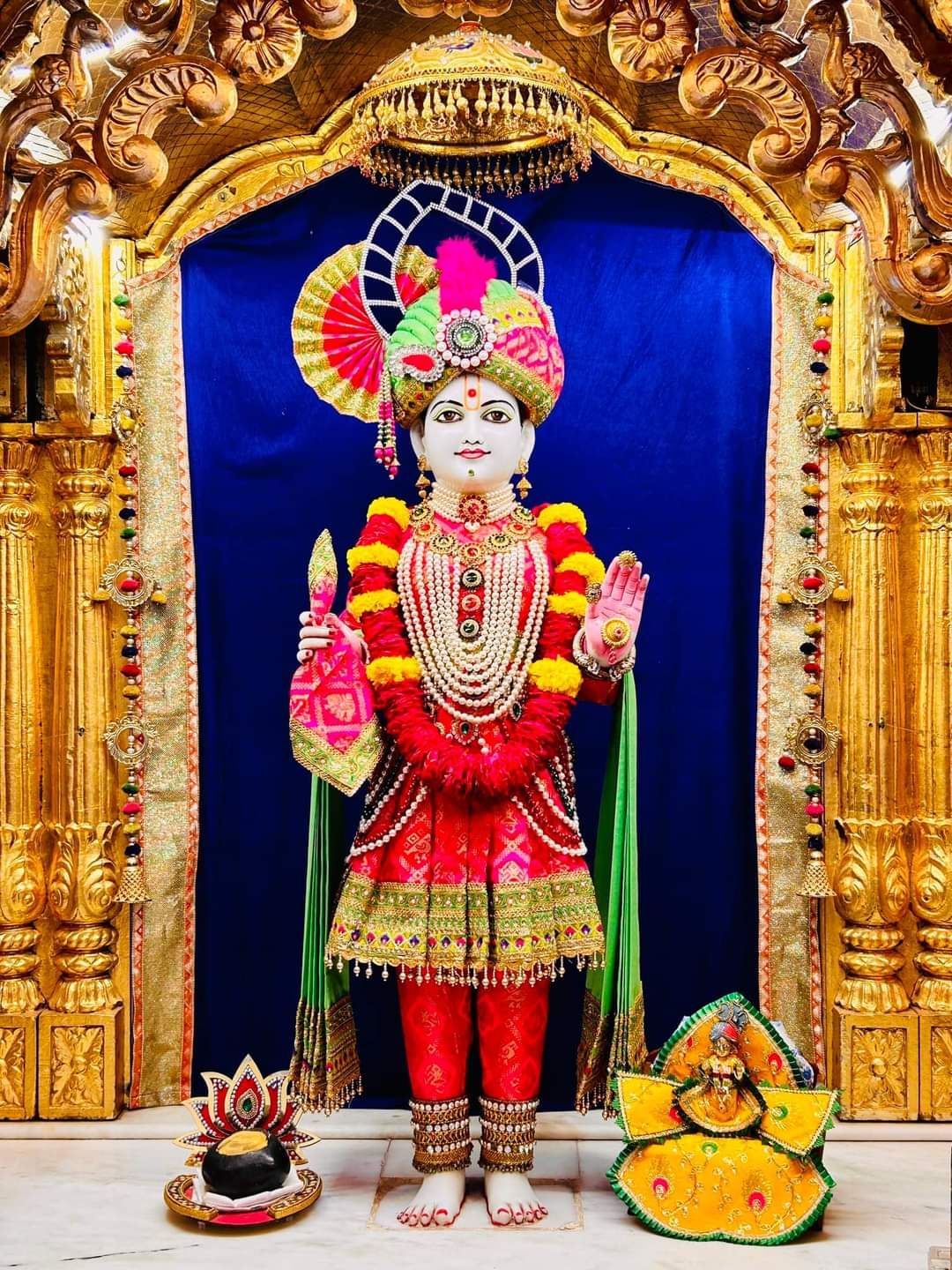 Swaminarayan murti in ornate temple setting