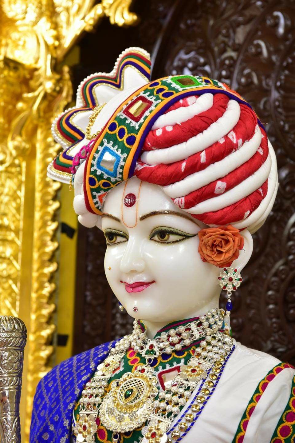 Swaminarayan with ornate headgear and jewelry