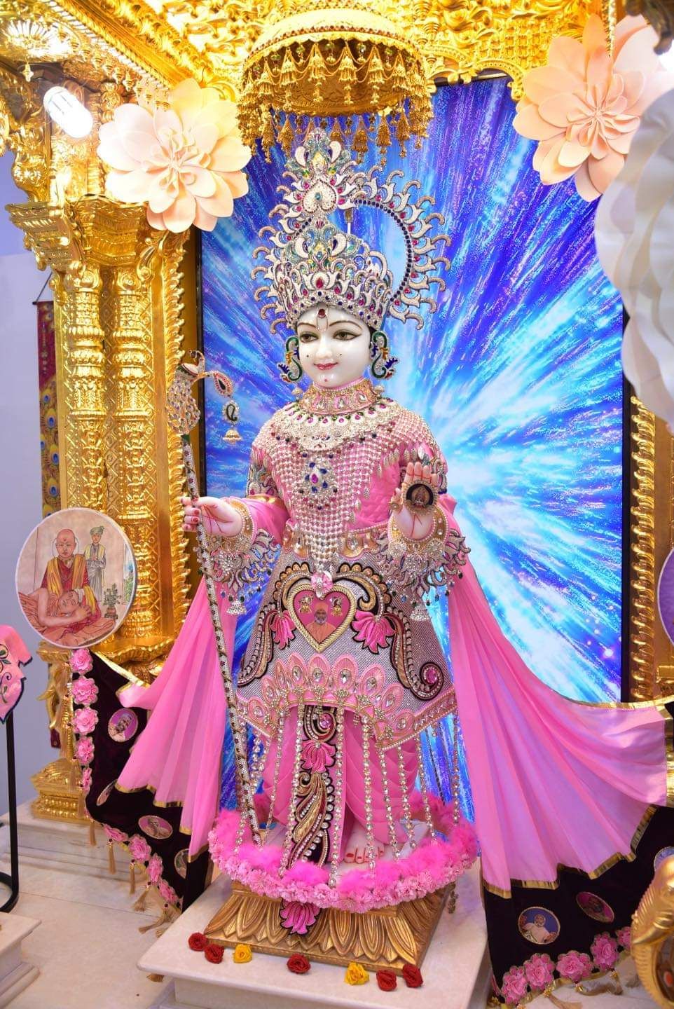 Swaminarayan statue in pink and gold