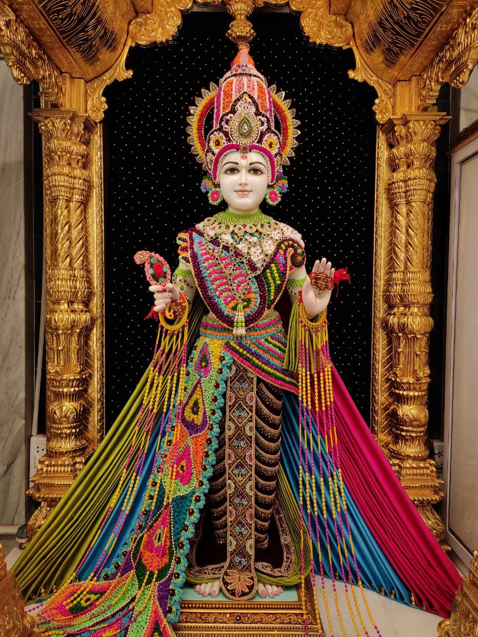 Swaminarayan Bhagwan adorned in vibrant attire