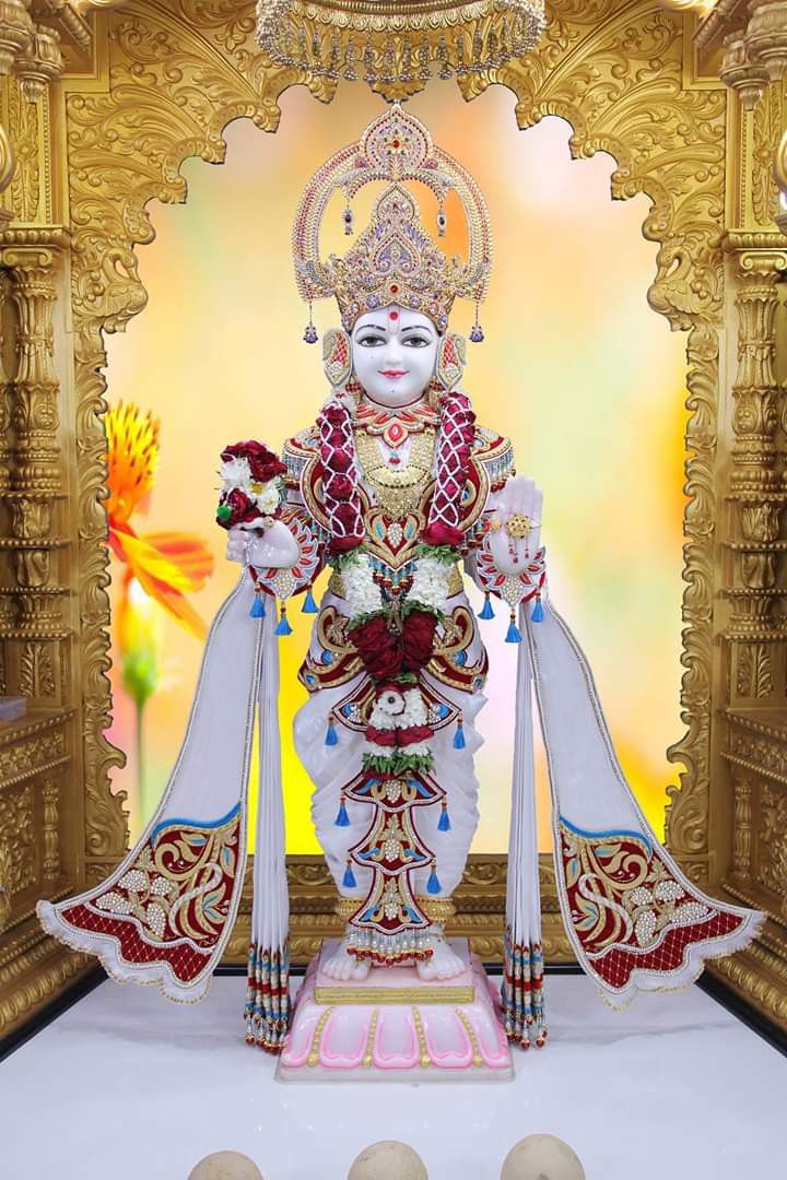 Swaminarayan murti in ornate temple setting