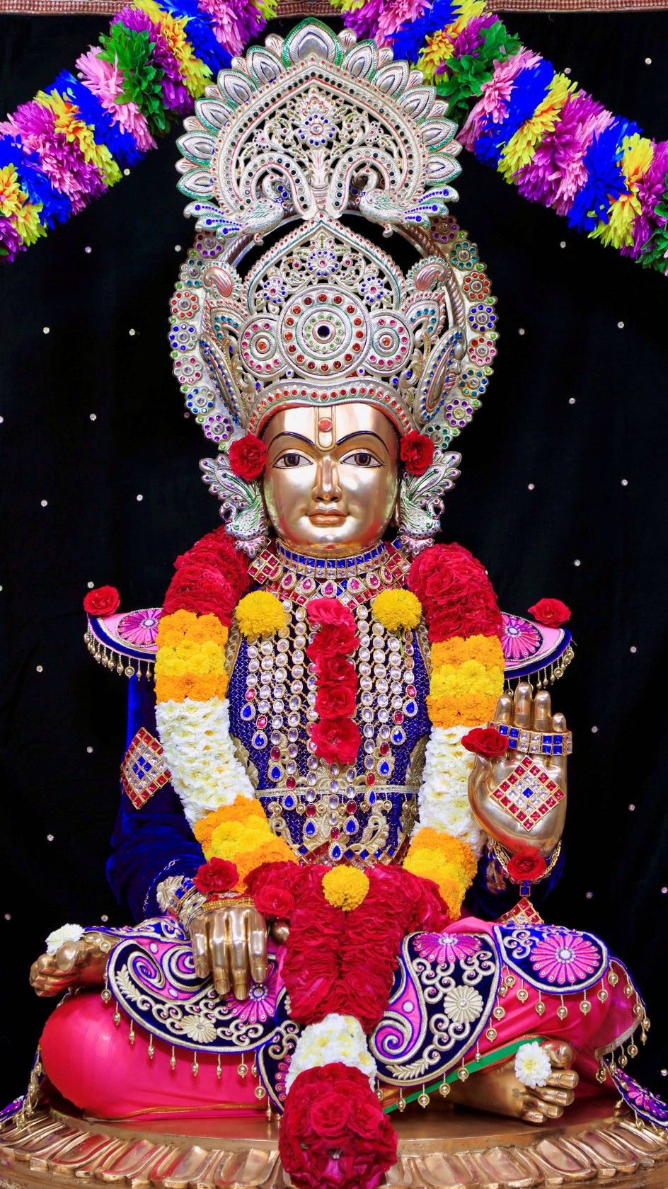 Swaminarayan deity golden floral backdrop
