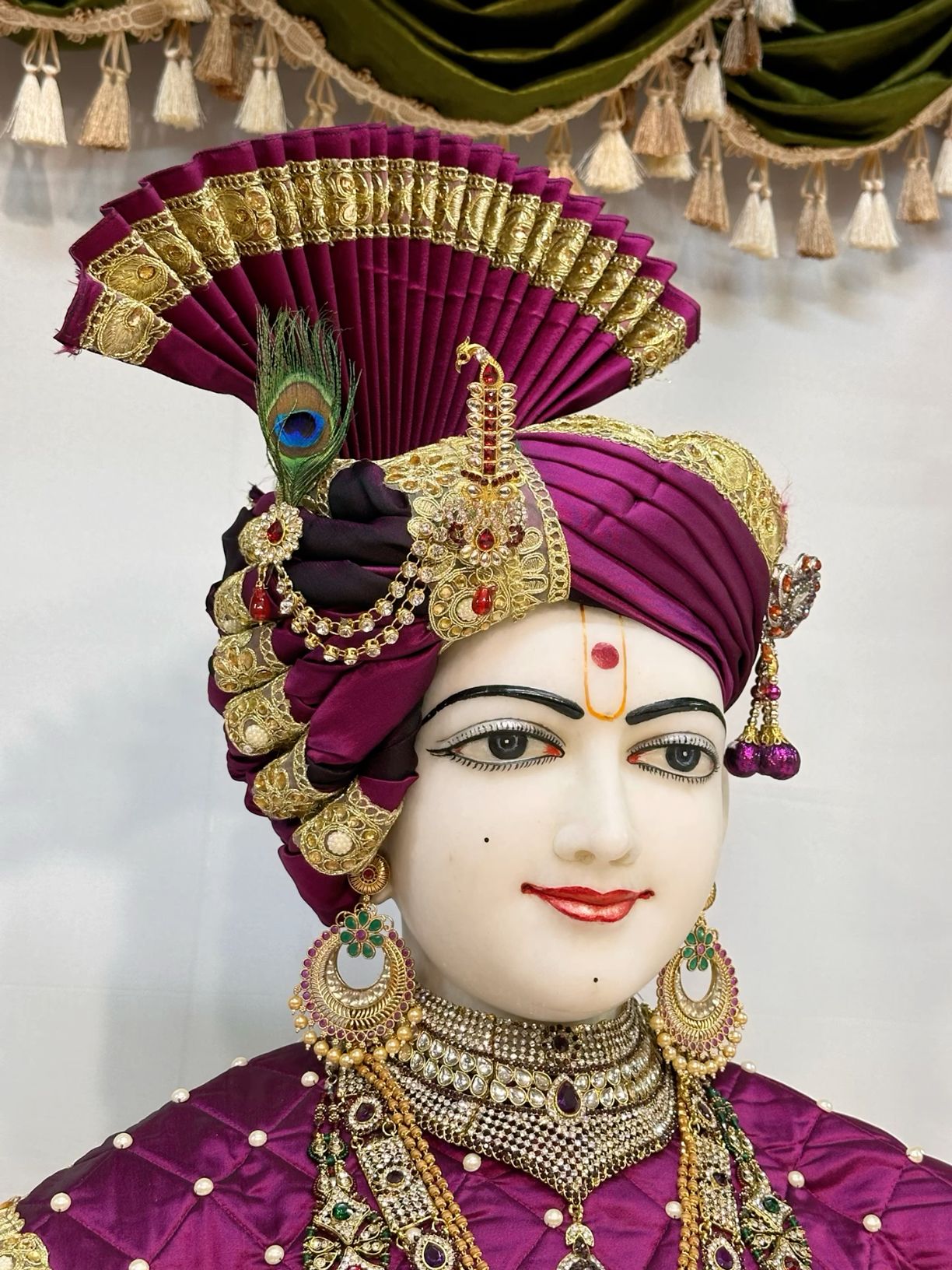 Swaminarayan with ornate purple turban