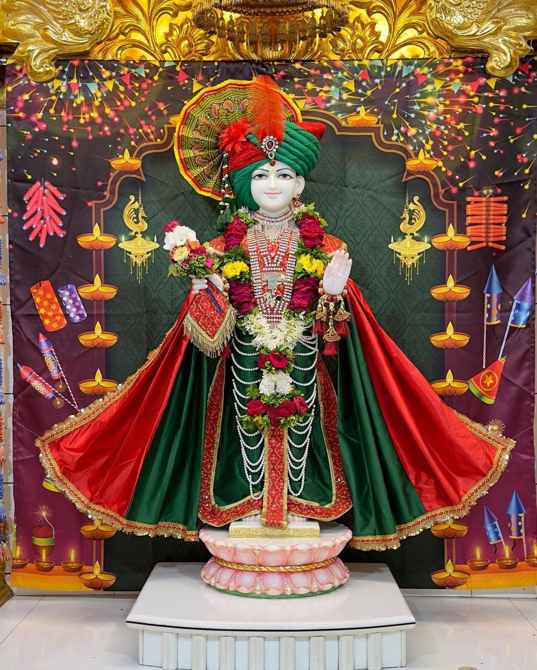 Swaminarayan idol in ornate temple setting
