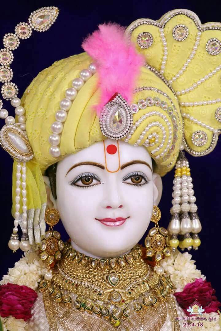 Close-up portrait of Swaminarayan deity.