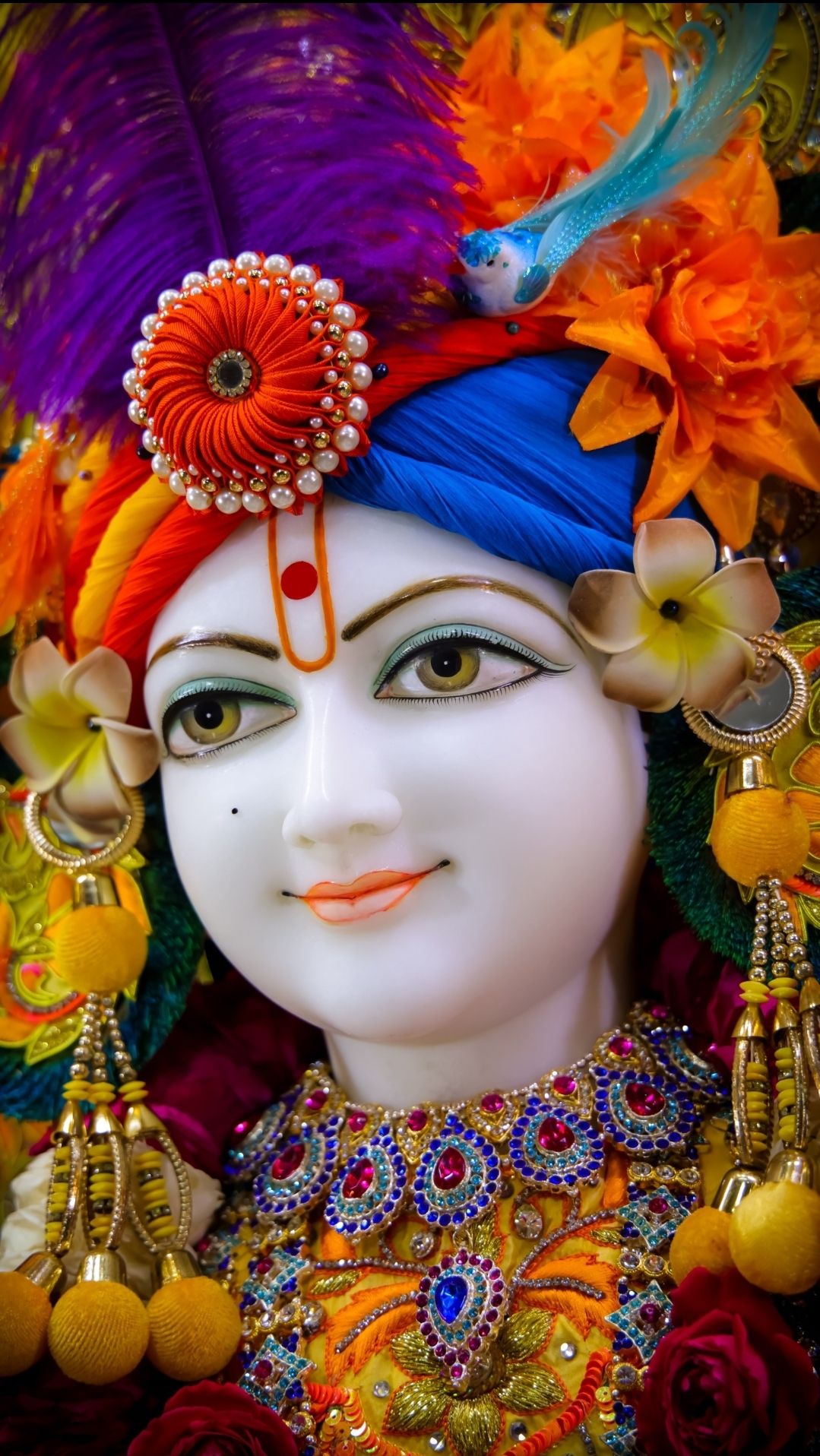 Swaminarayan with floral crown and jewels