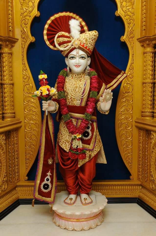 Swaminarayan statue in ornate temple setting