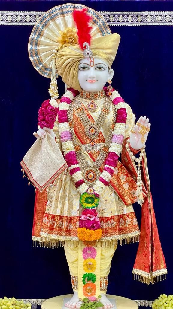 Swaminarayan deity in ornate golden attire