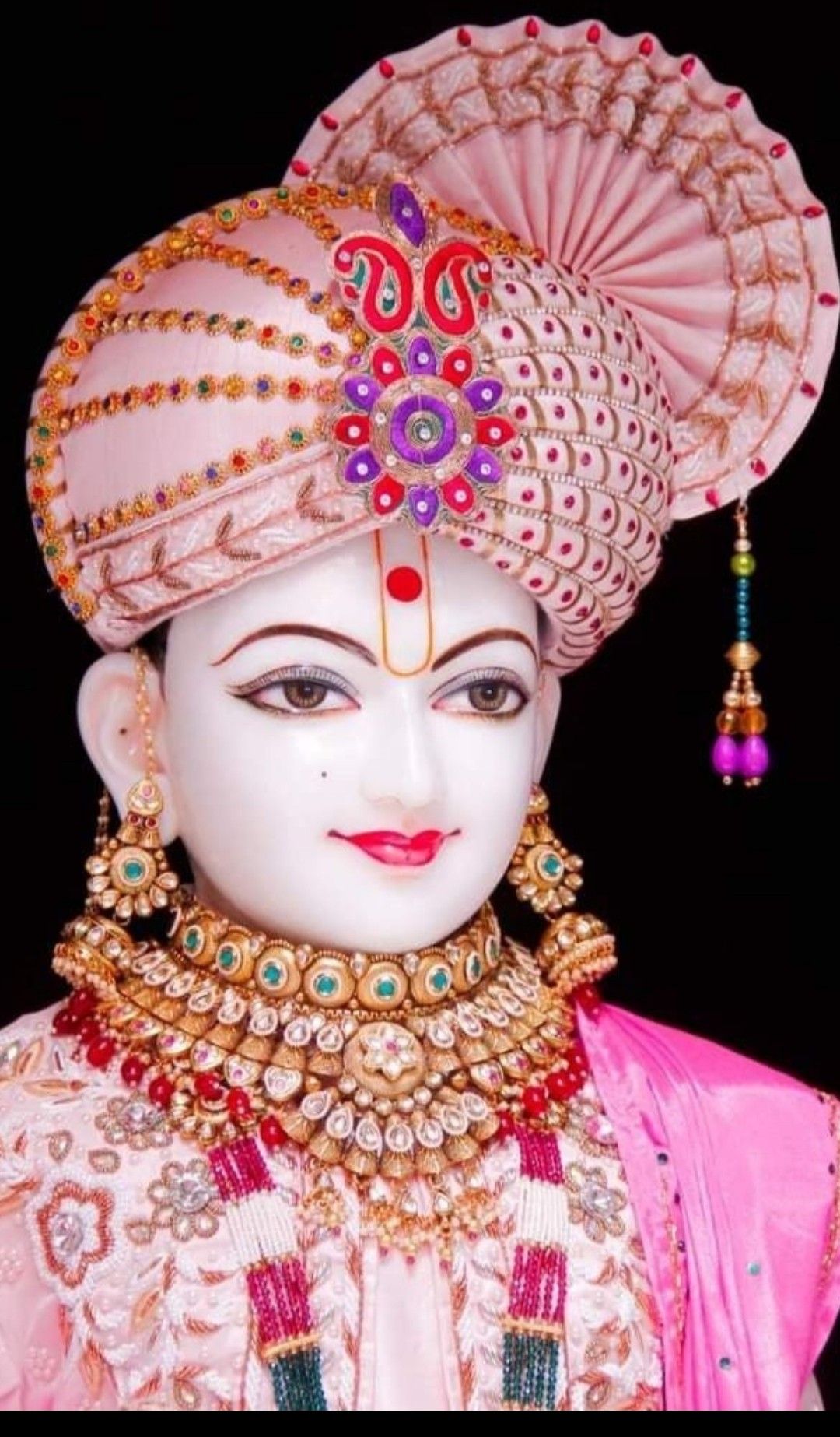 Swaminarayan with ornate jewelry