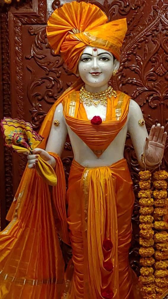 Swaminarayan statue in orange attire