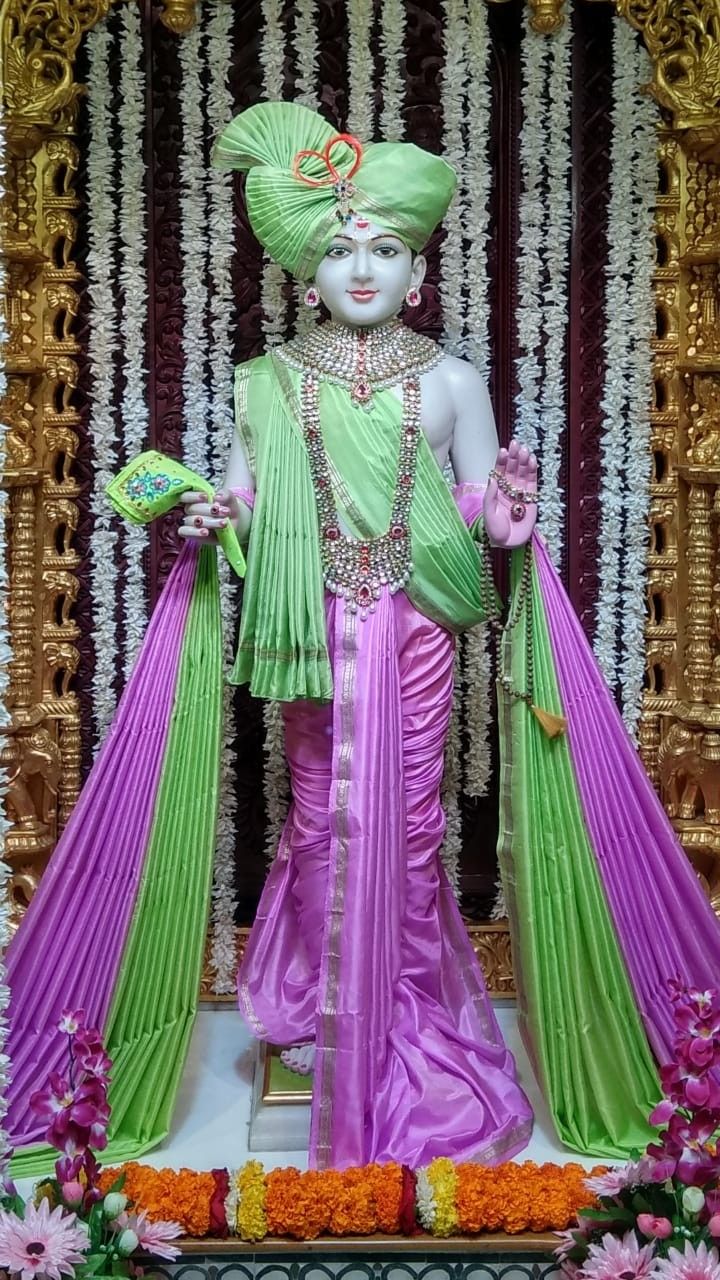 Swaminarayan deity with floral decorations