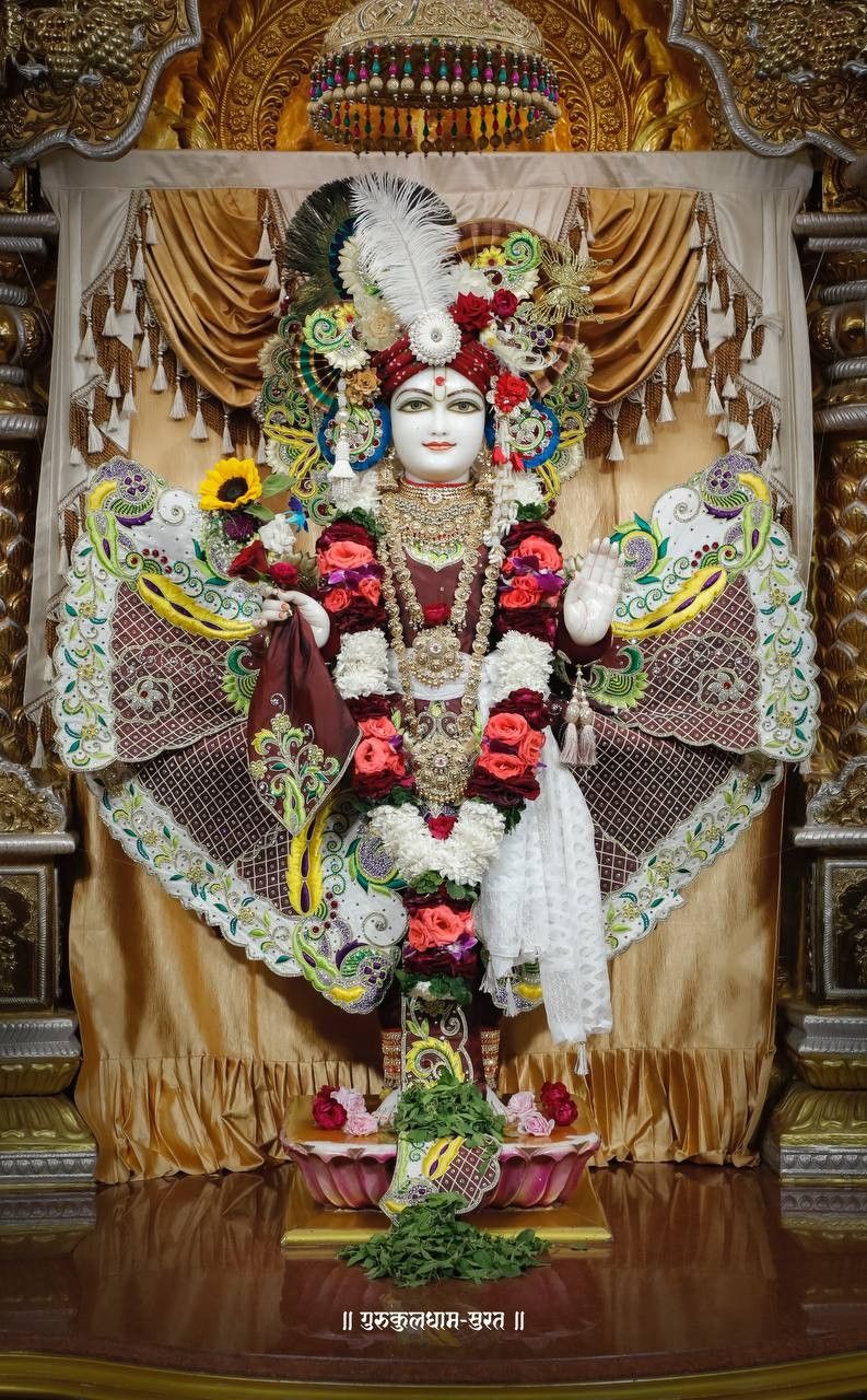 Swaminarayan deity in ornate temple setting