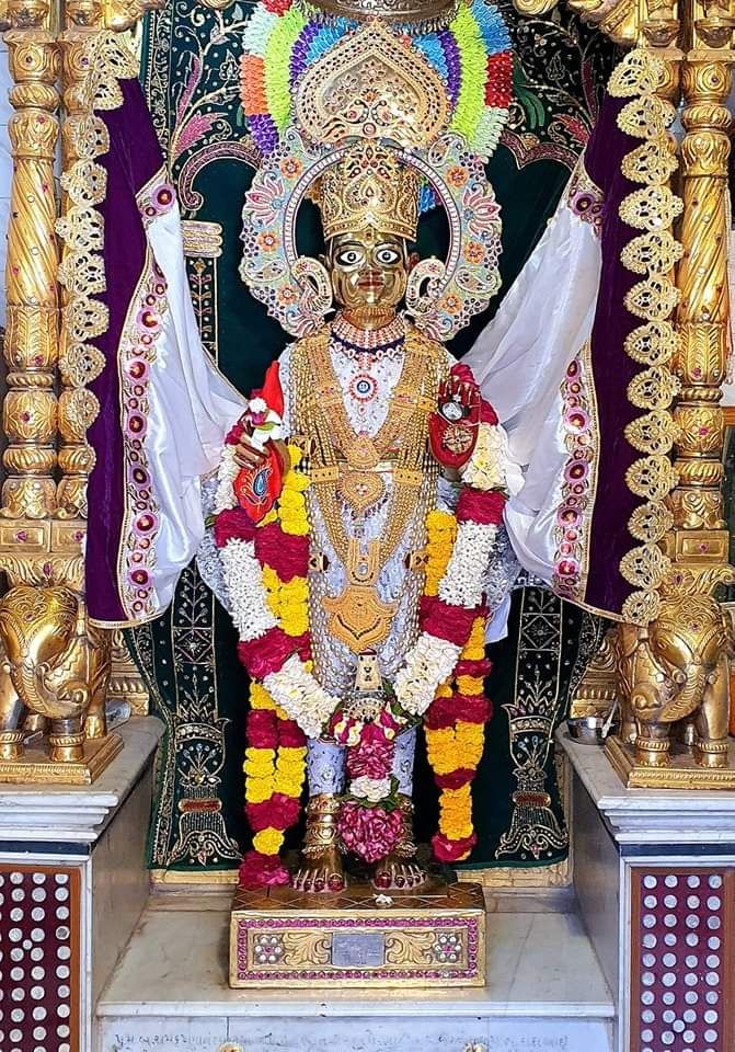 Swaminarayan deity adorned with floral garlands
