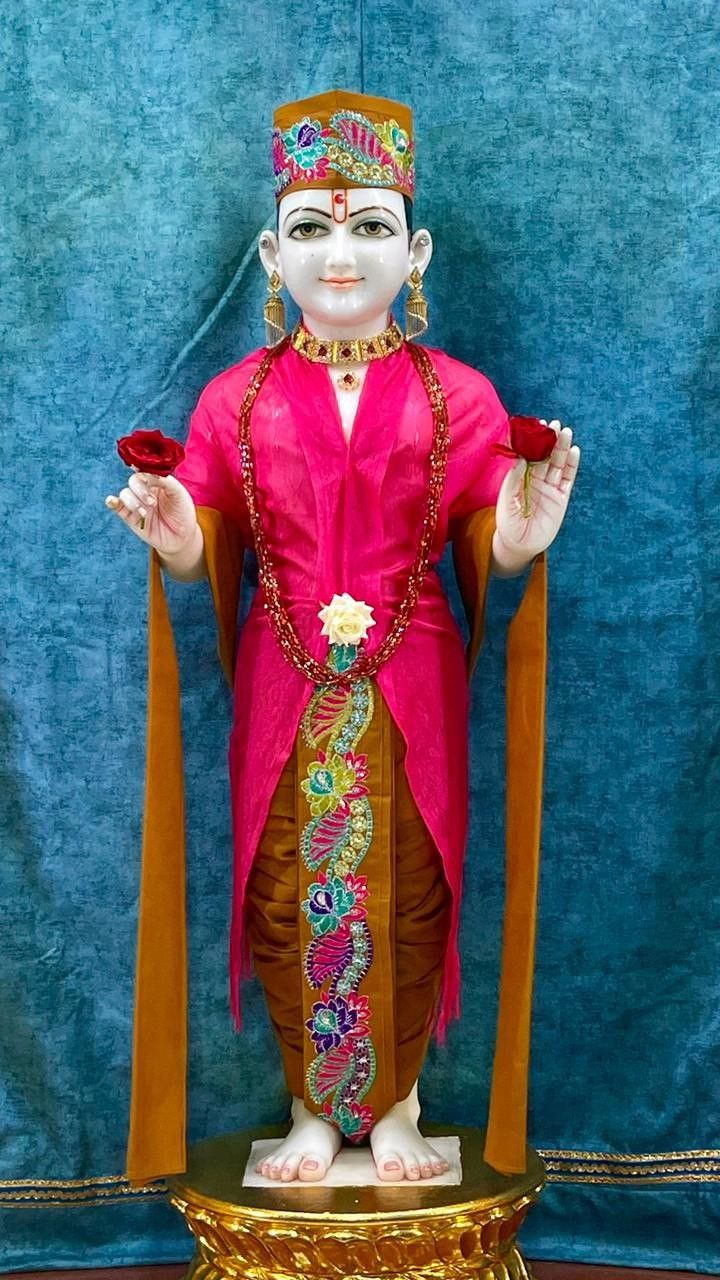 Swaminarayan deity with pink attire