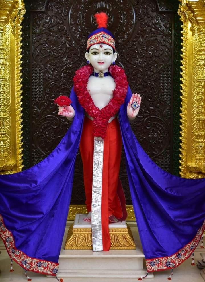 Swaminarayan murti with flower garland