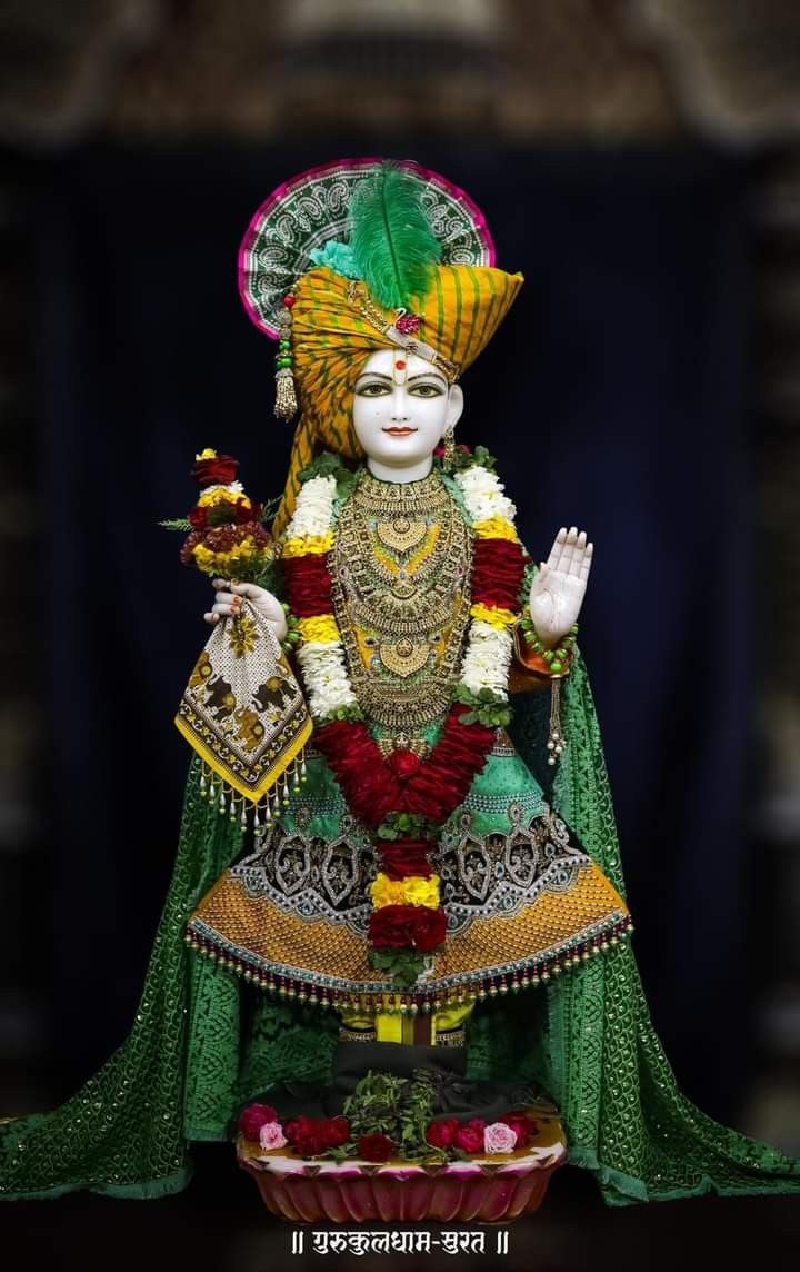 Swaminarayan in ornate traditional clothing.