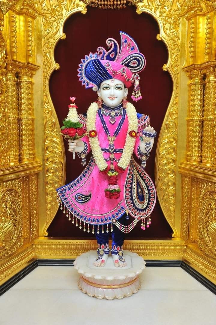 Swaminarayan deity in ornate temple setting