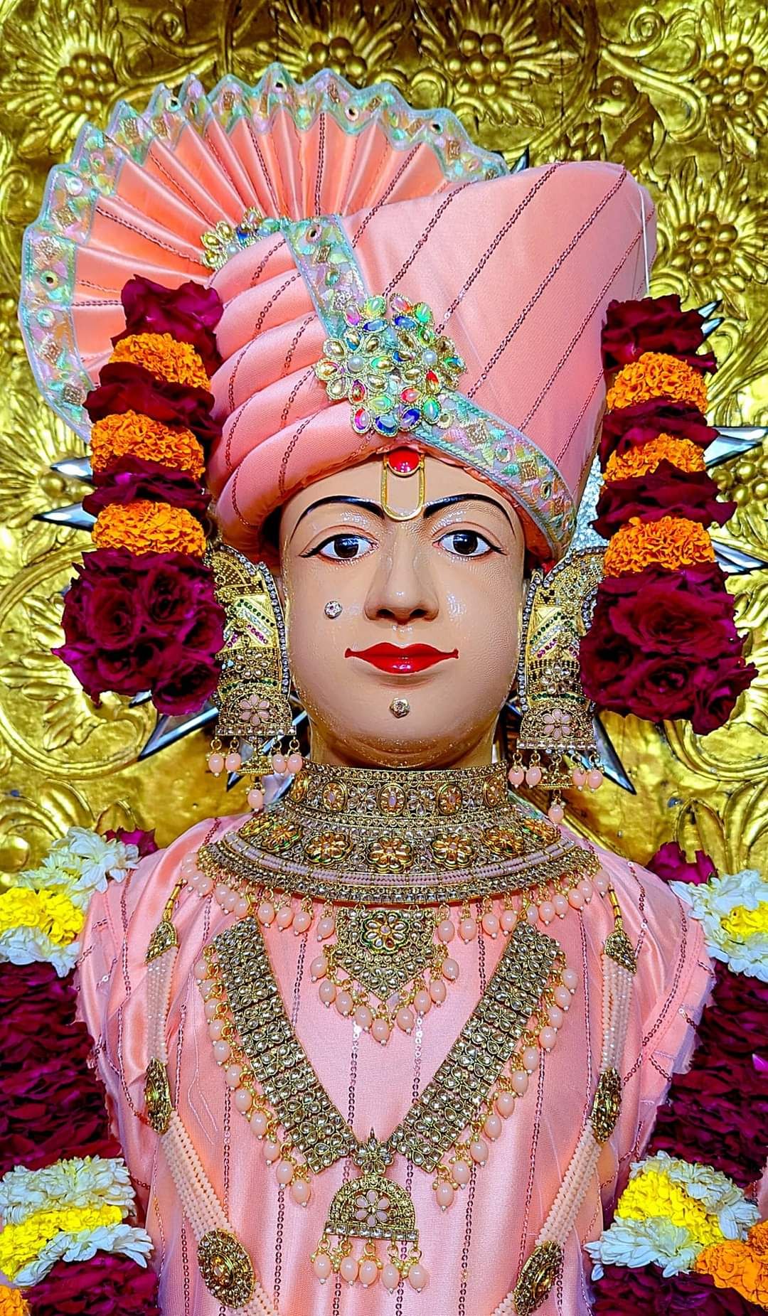 Swaminarayan deity with floral garland