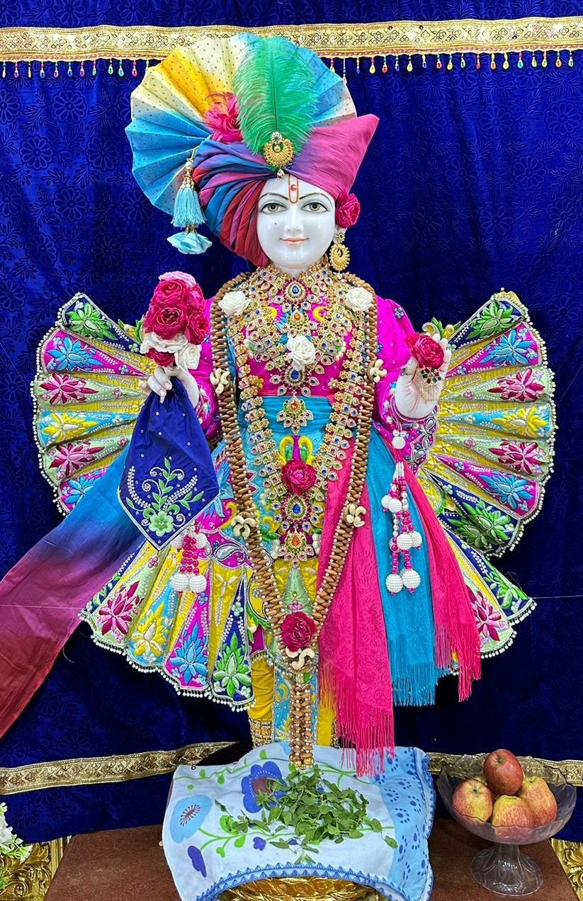 Swaminarayan adorned in colorful attire