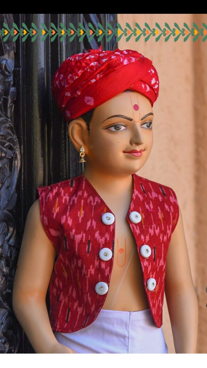Swaminarayan deity in red attire