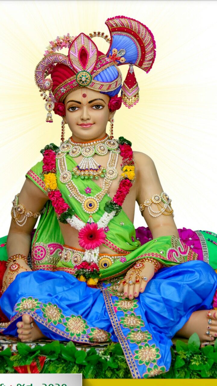 Swaminarayan adorned with flowers and jewels