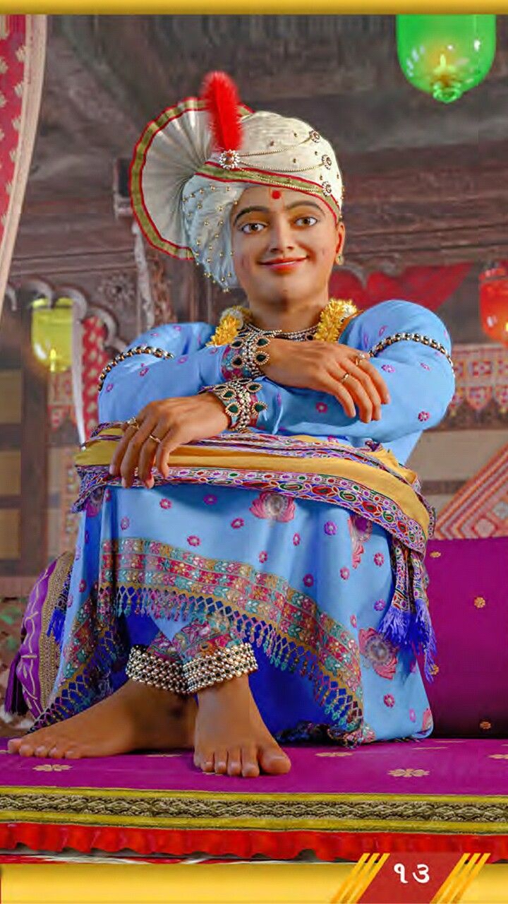 Swaminarayan in traditional attire smiling