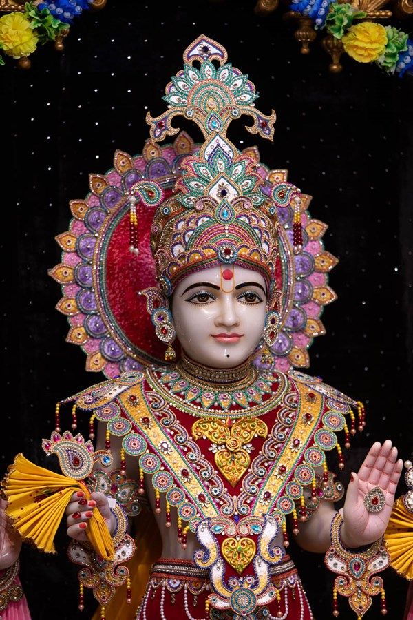 Swaminarayan with ornate crown and attire
