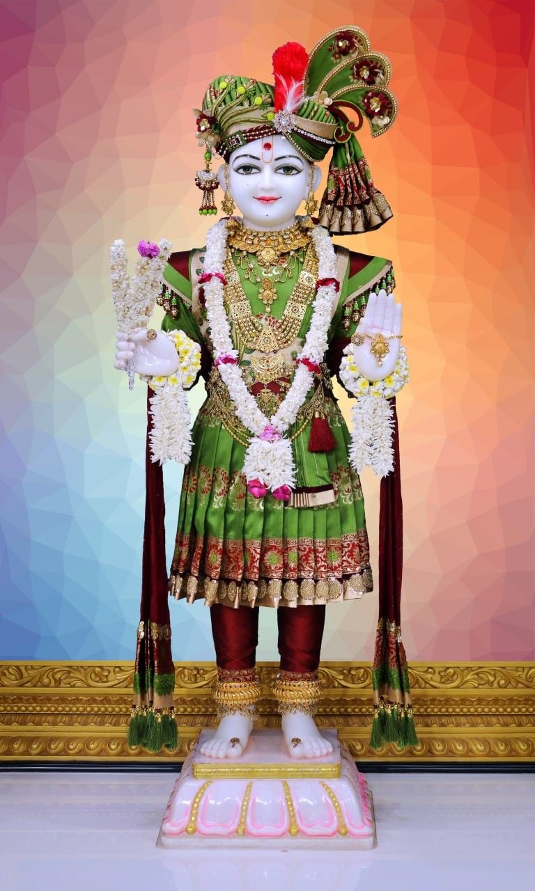 Swaminarayan deity in vibrant attire