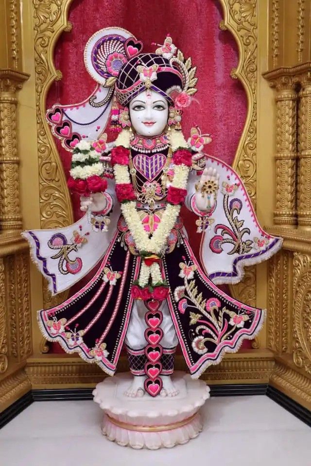 Swaminarayan idol with floral decorations