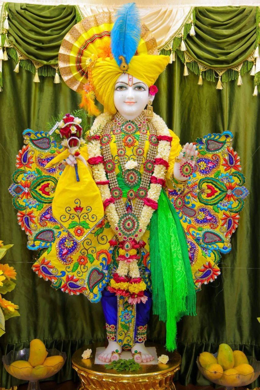 Swaminarayan statue with floral decorations