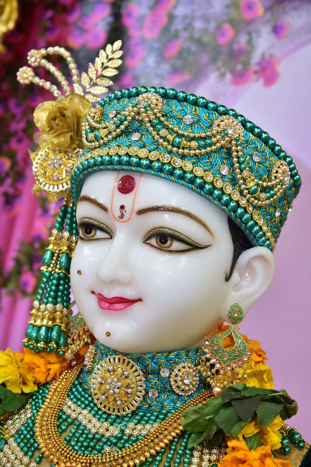 Close-up of Swaminarayan with ornate jewelry