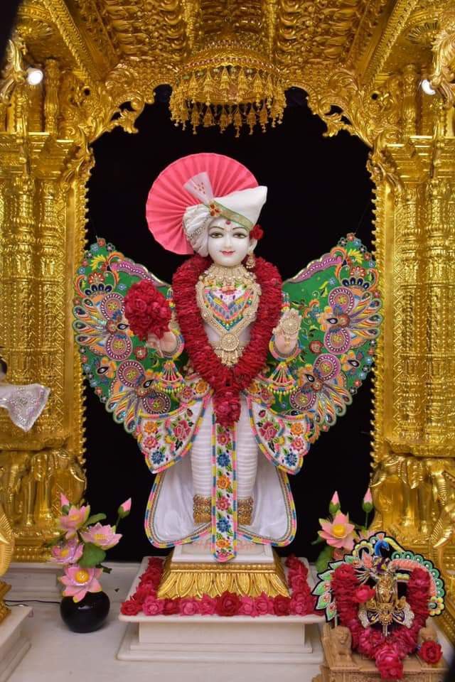 Swaminarayan deity in ornate temple setting