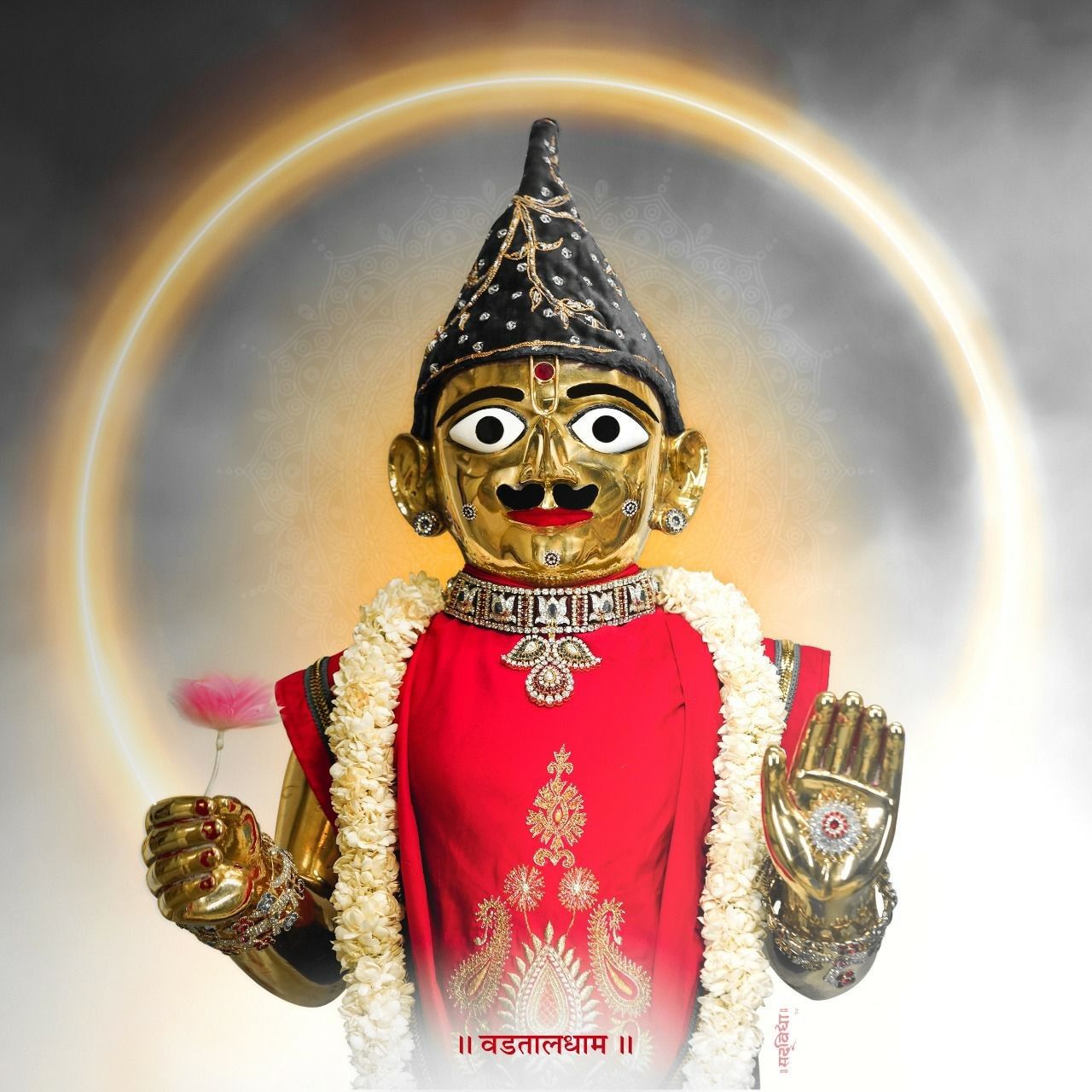 Swaminarayan murti with gold jewelry