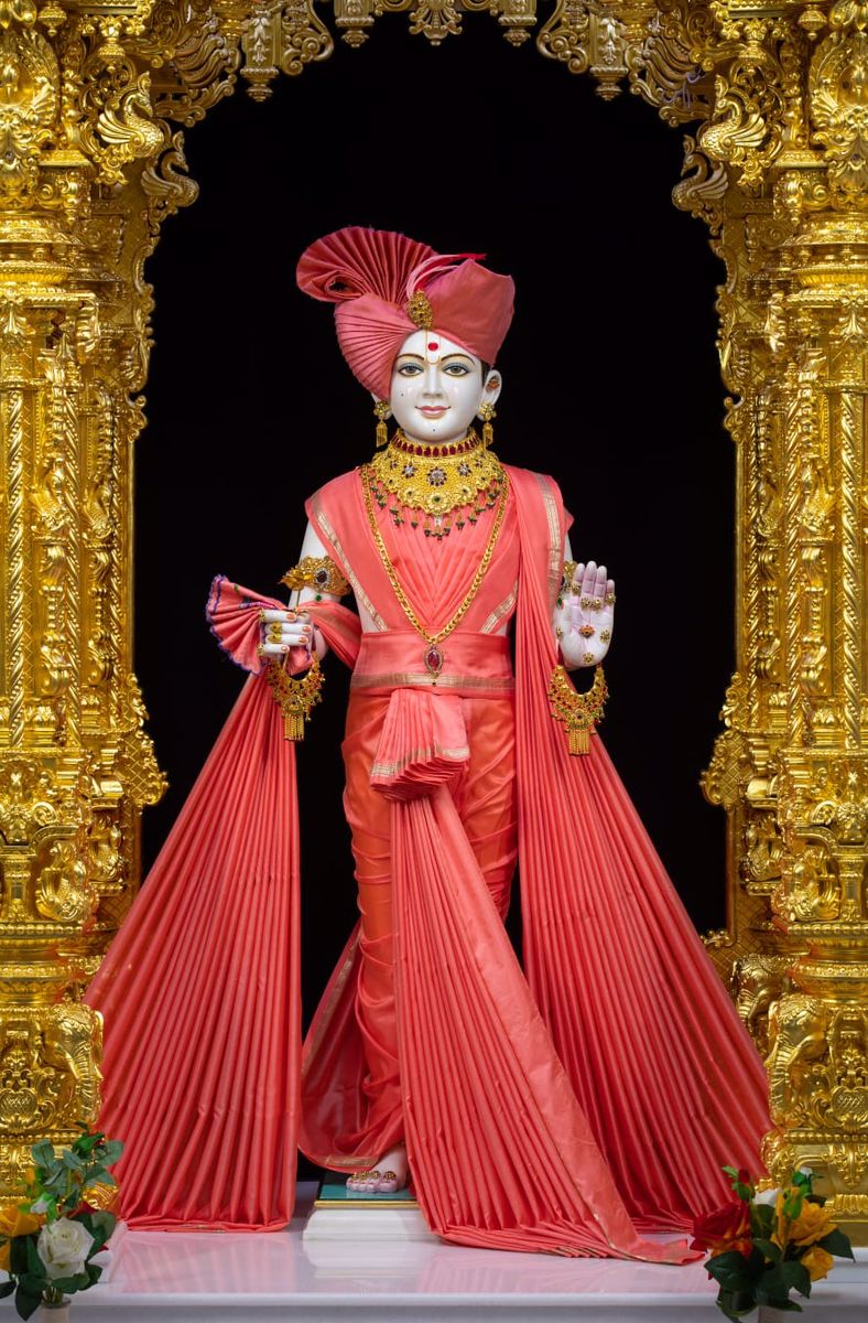 Swaminarayan idol in gold temple frame