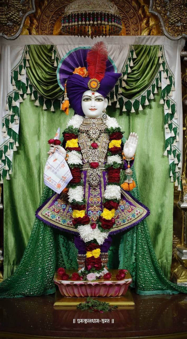 Swaminarayan adorned in regal attire.