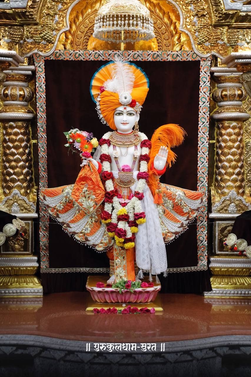 Swaminarayan deity with floral garland.