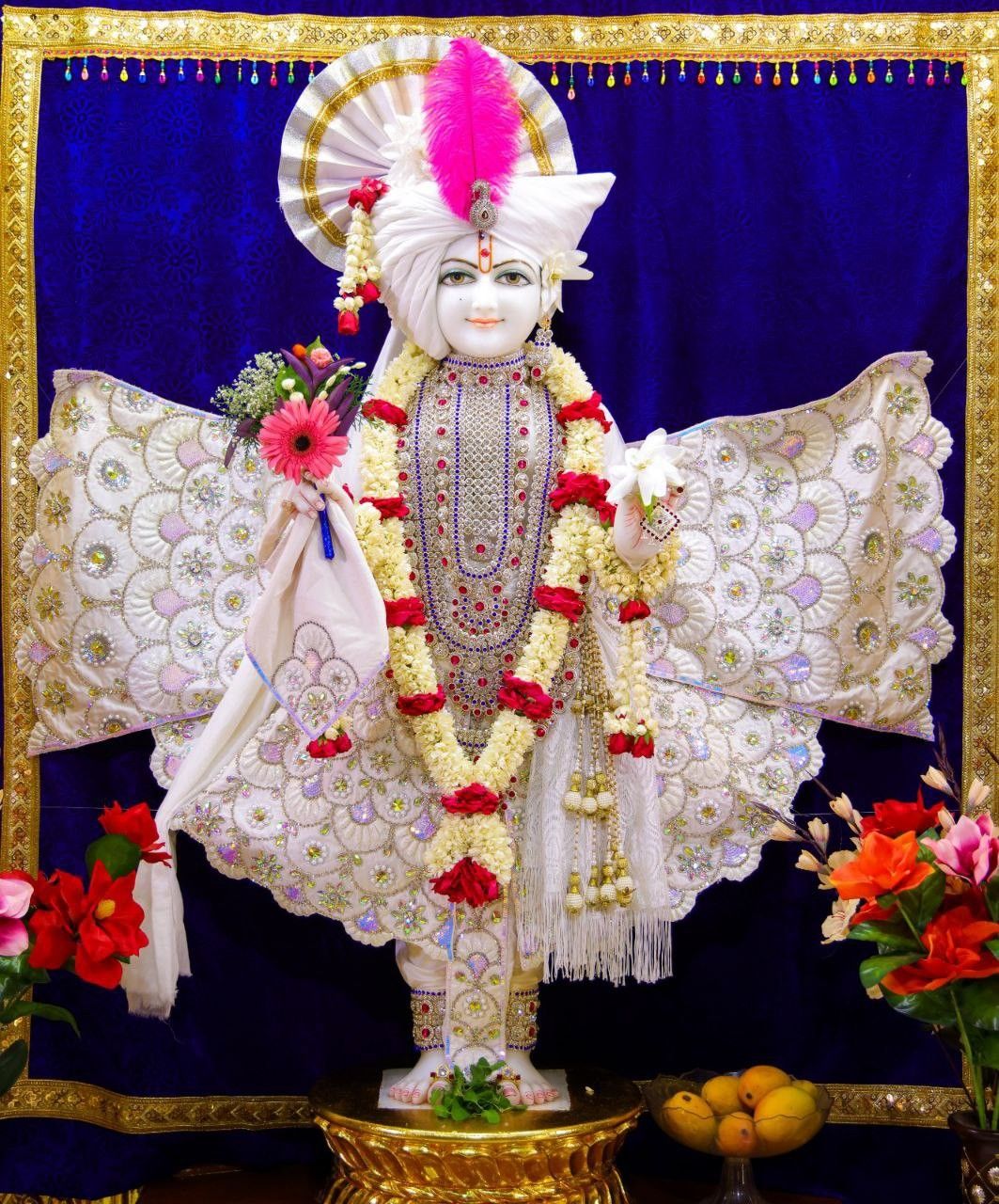 Swaminarayan deity adorned with flowers