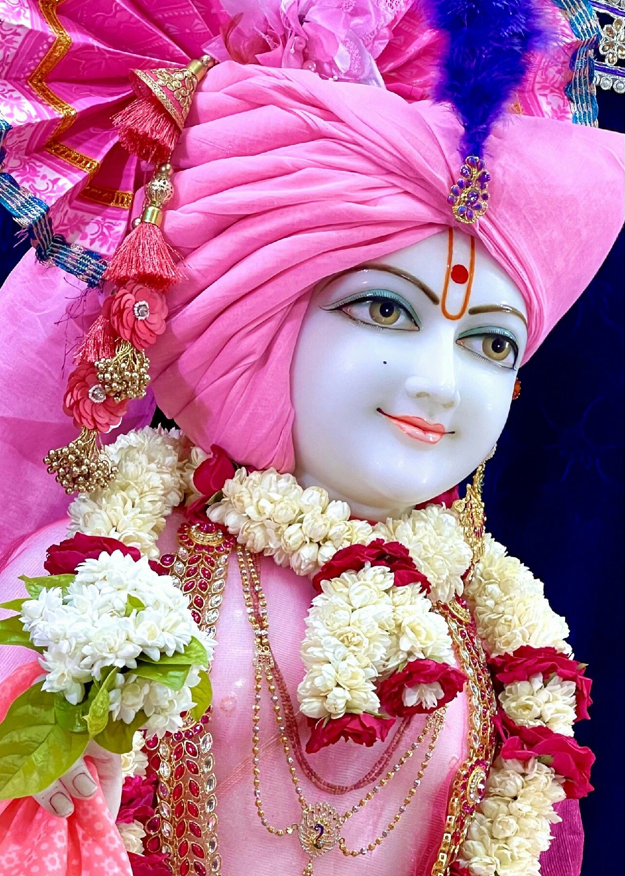 Swaminarayan Bhagwan with floral decorations