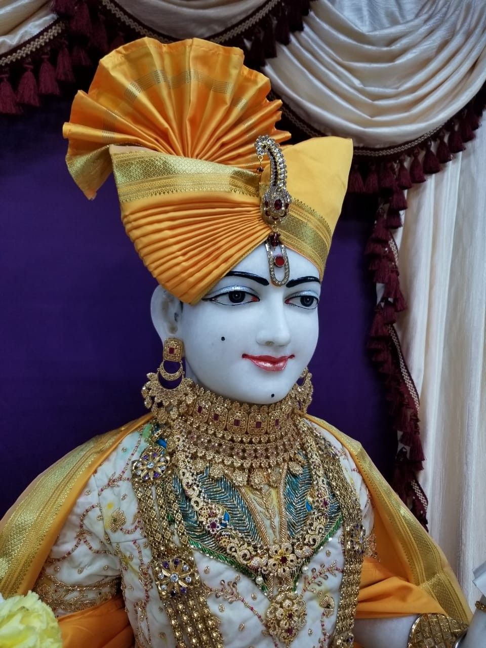 Swaminarayan with golden adornments