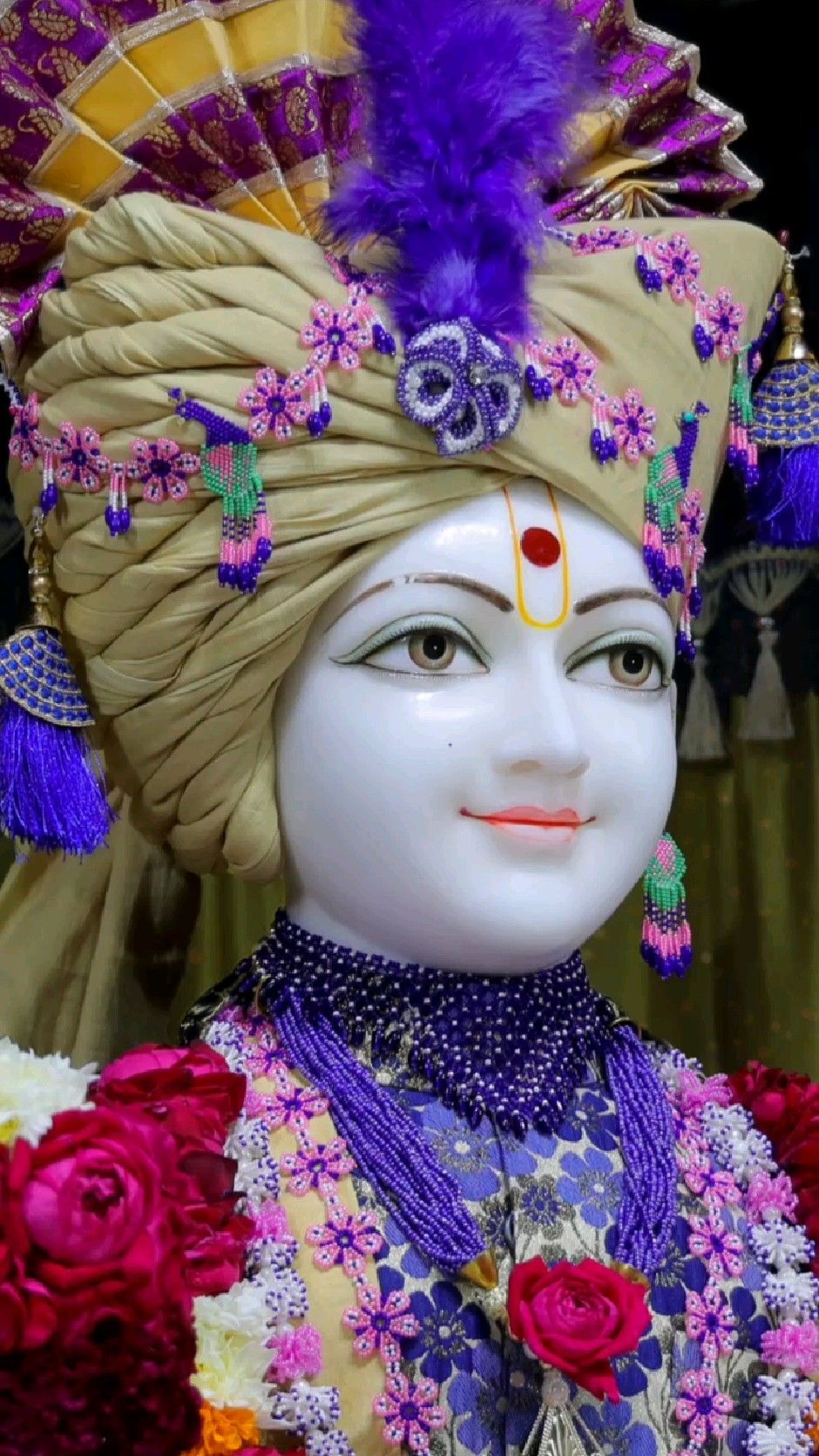 Close-up of Swaminarayan with floral turban.