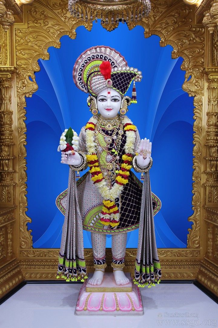 Swaminarayan murti in a decorated temple