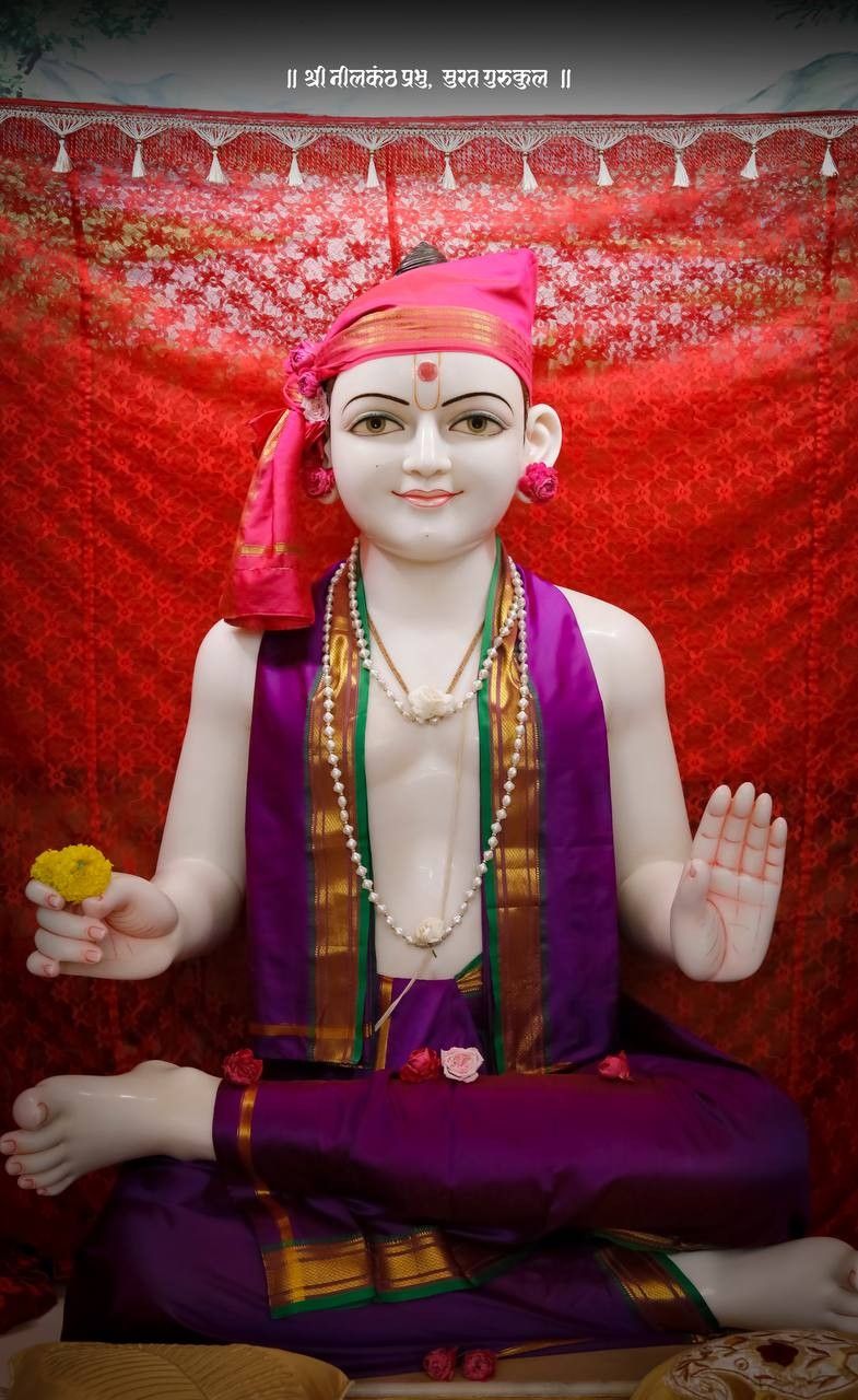 Marble statue of Swaminarayan with blessings.