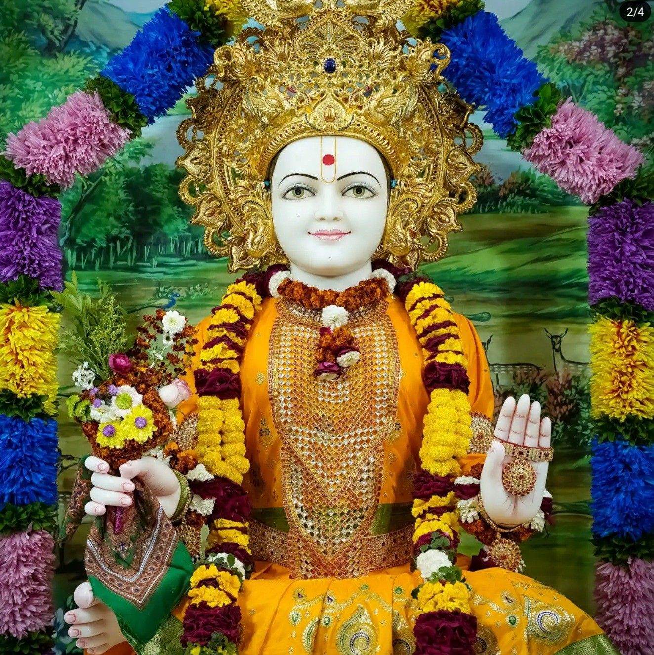 Swaminarayan idol adorned with flowers