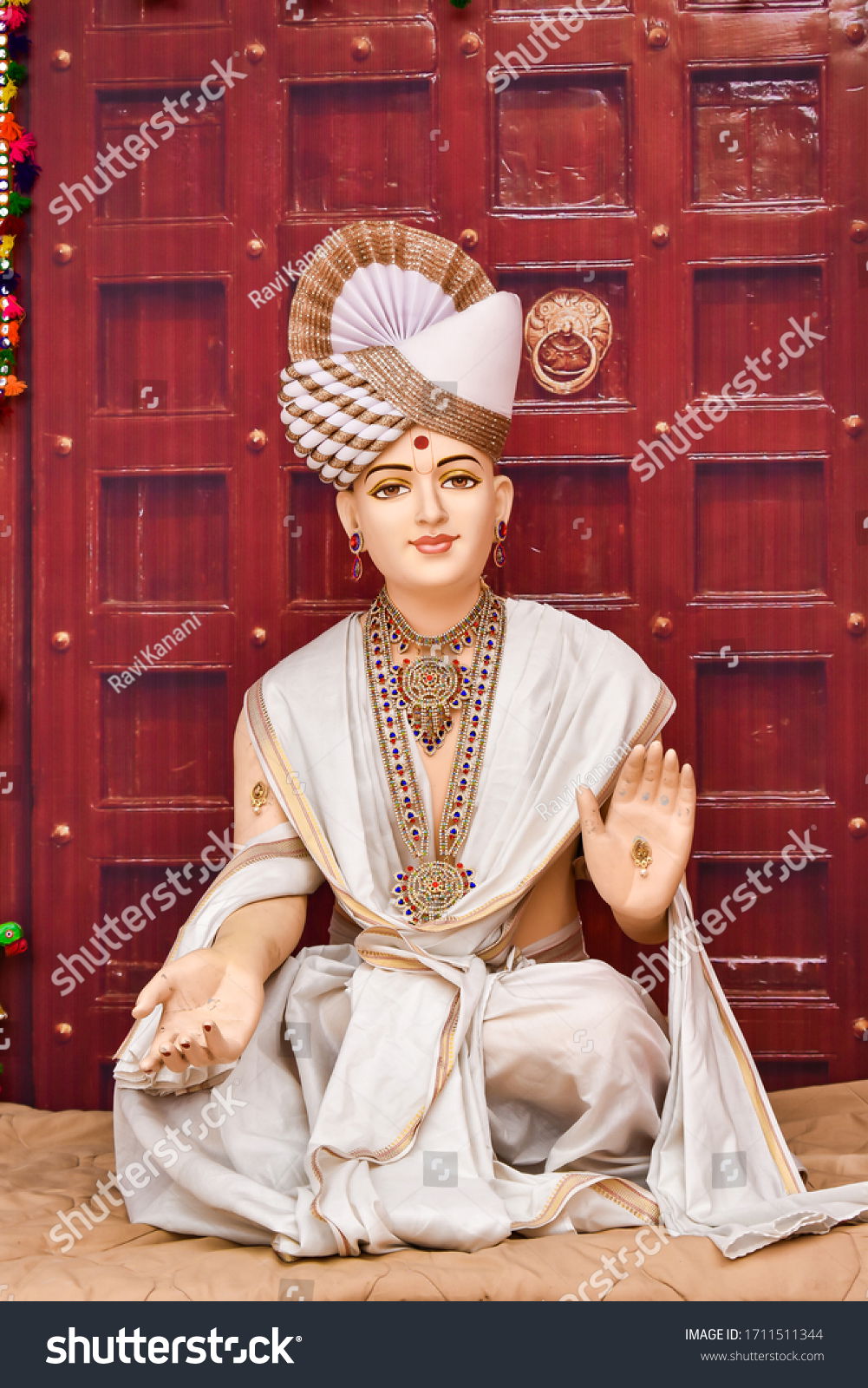 Swaminarayan statue with blessing gesture