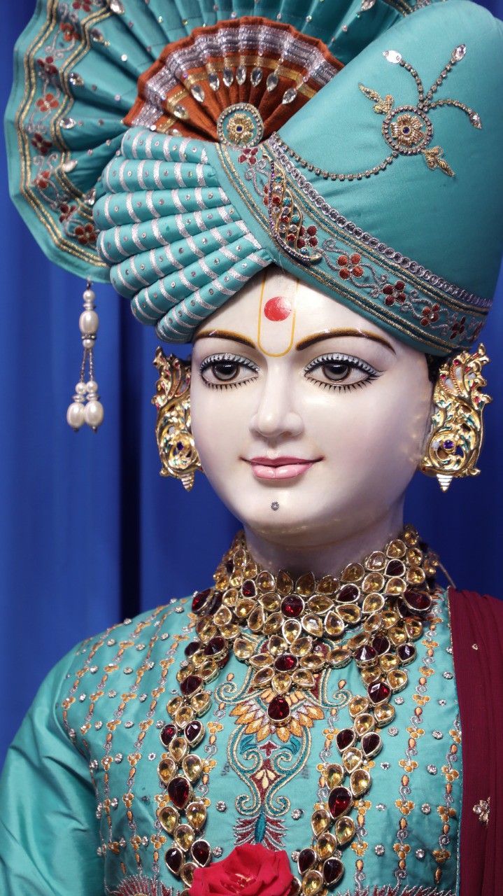 Swaminarayan portrait with ornate jewelry